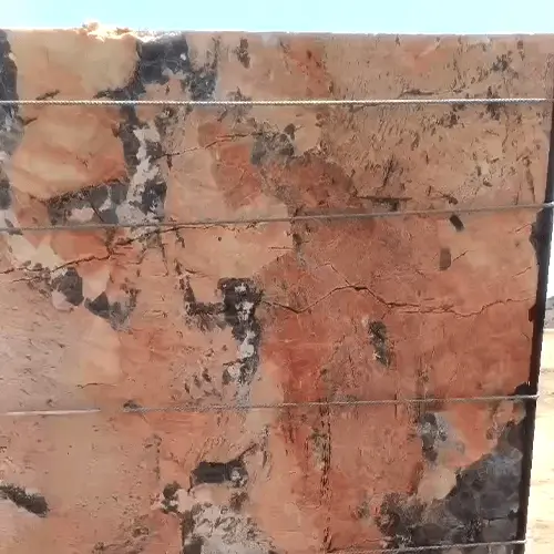 Polished Red Granite Slab with Bold Black and Cream Mineral Movement image 2